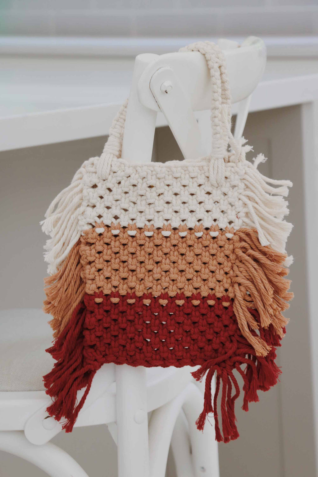Crochet bag, made with recycled cotton yarn with stripes white, tan and burgundy.