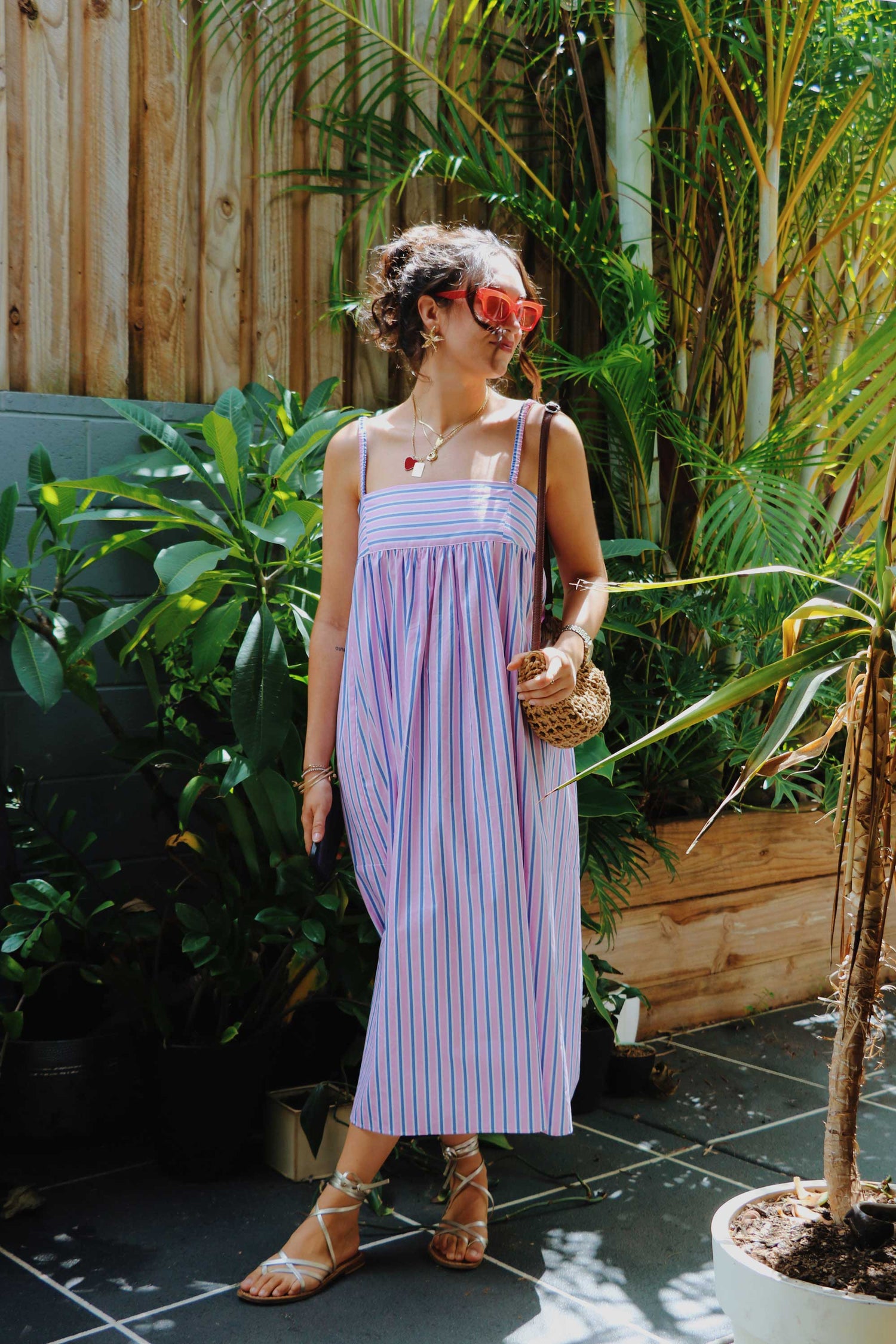 Maxi dress in pink, blue, white stripes.