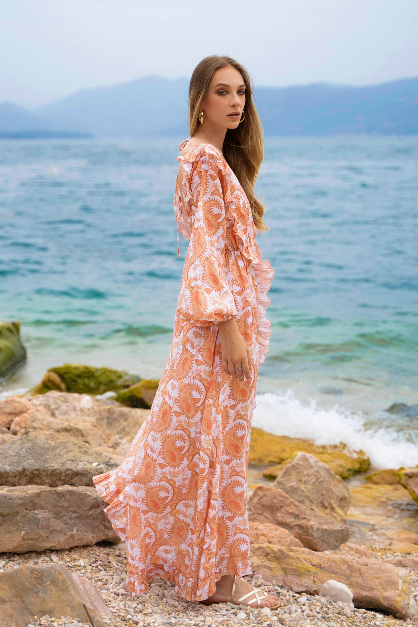 Floral linen maxi dress, with long puff sleeves, a-line skirt, ruffles and open back.