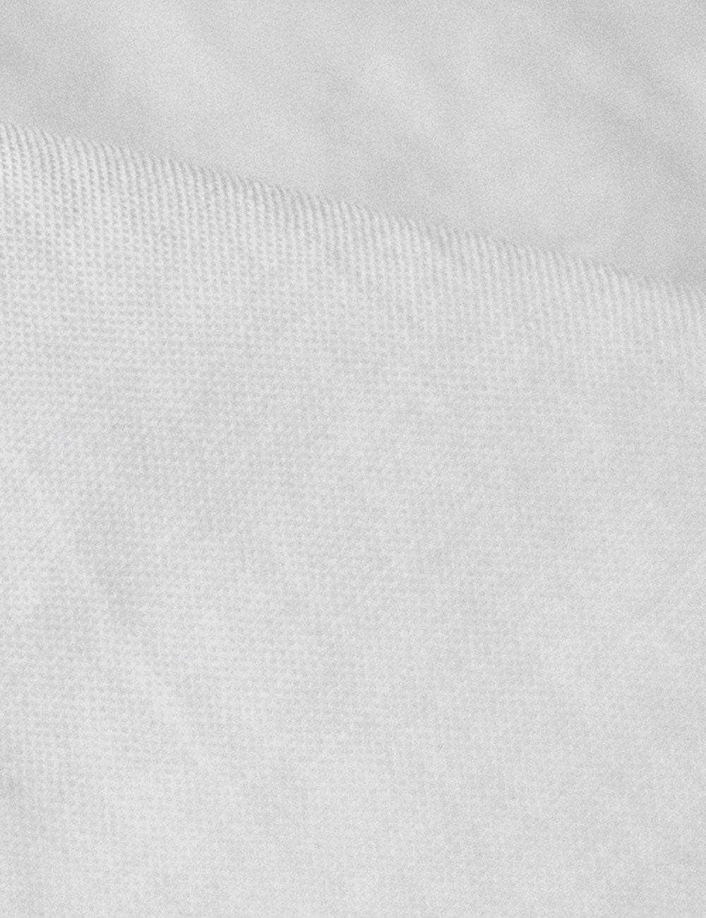 Close-up photograph of organic cotton fabric for sustainable fashion clothing.