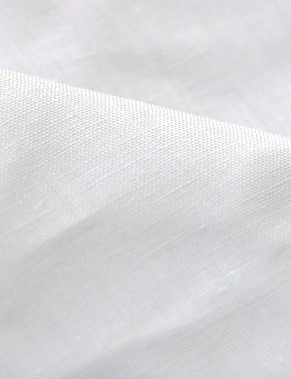 Close-up photograph of organic cotton hemp fabric for sustainable fashion clothing.