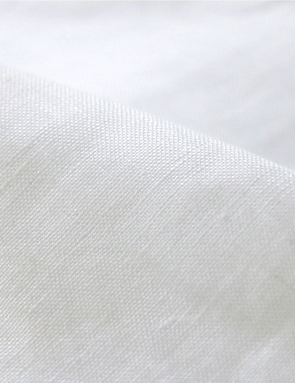 Close-up photograph of linen fabric for sustainable fashion clothing.