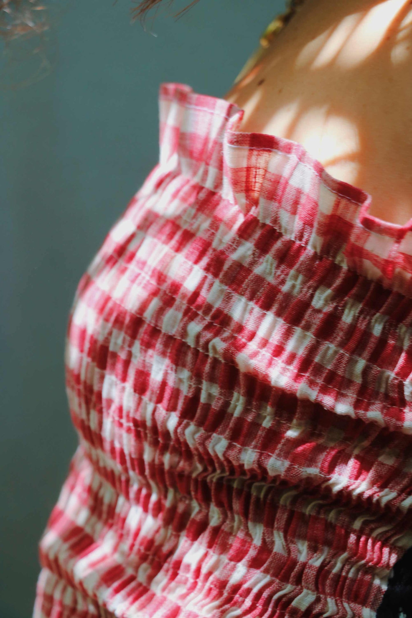 Strapless shirred red gingham midi dress.