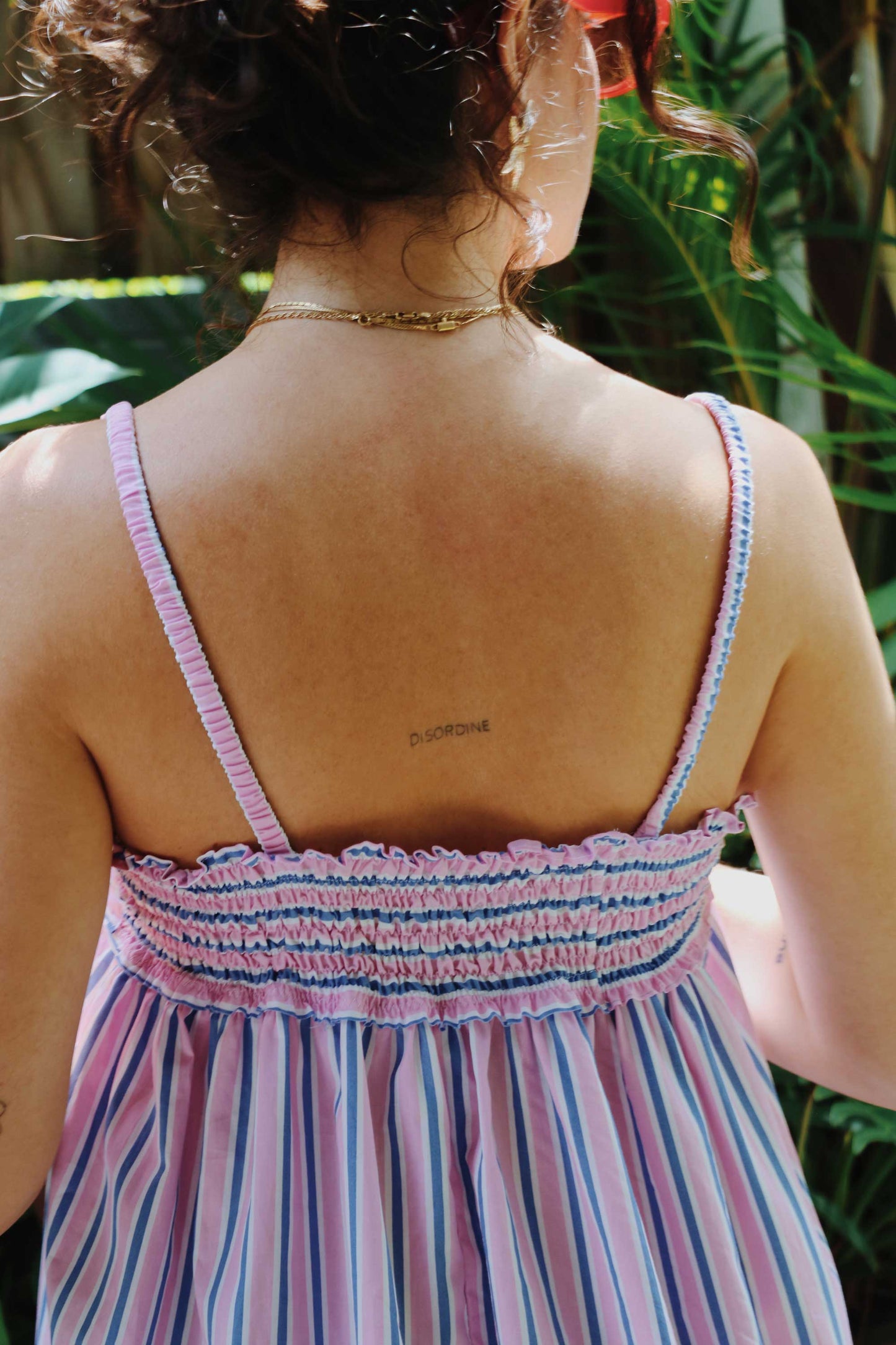 Maxi dress in pink, blue, white stripes with shirred back.