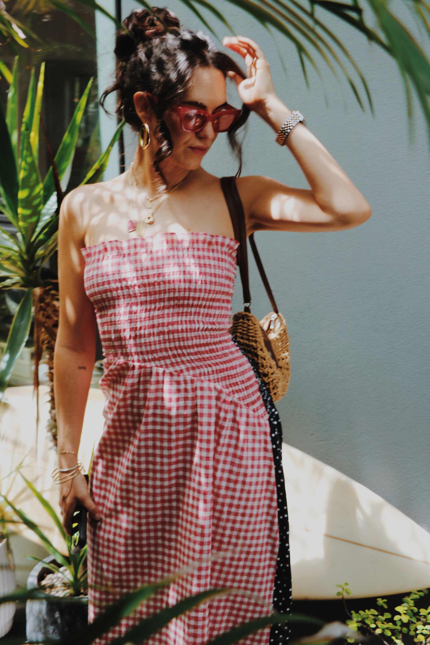 Strapless shirred red gingham midi dress.