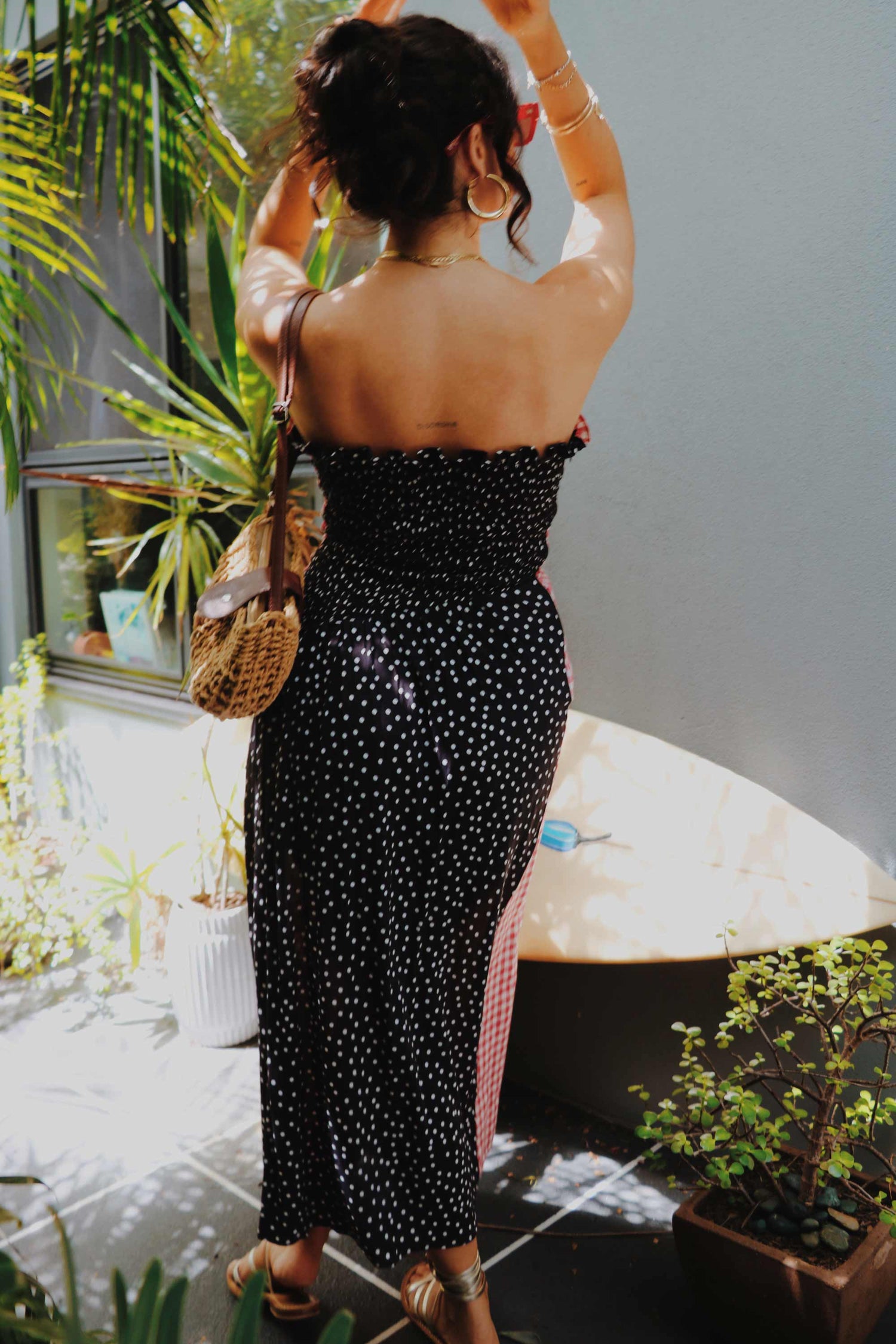 Strapless shirred red gingham midi dress.