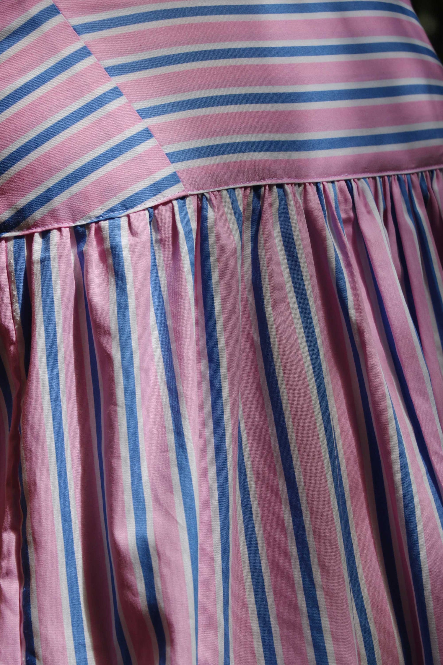 Maxi dress in pink, blue, white stripes.