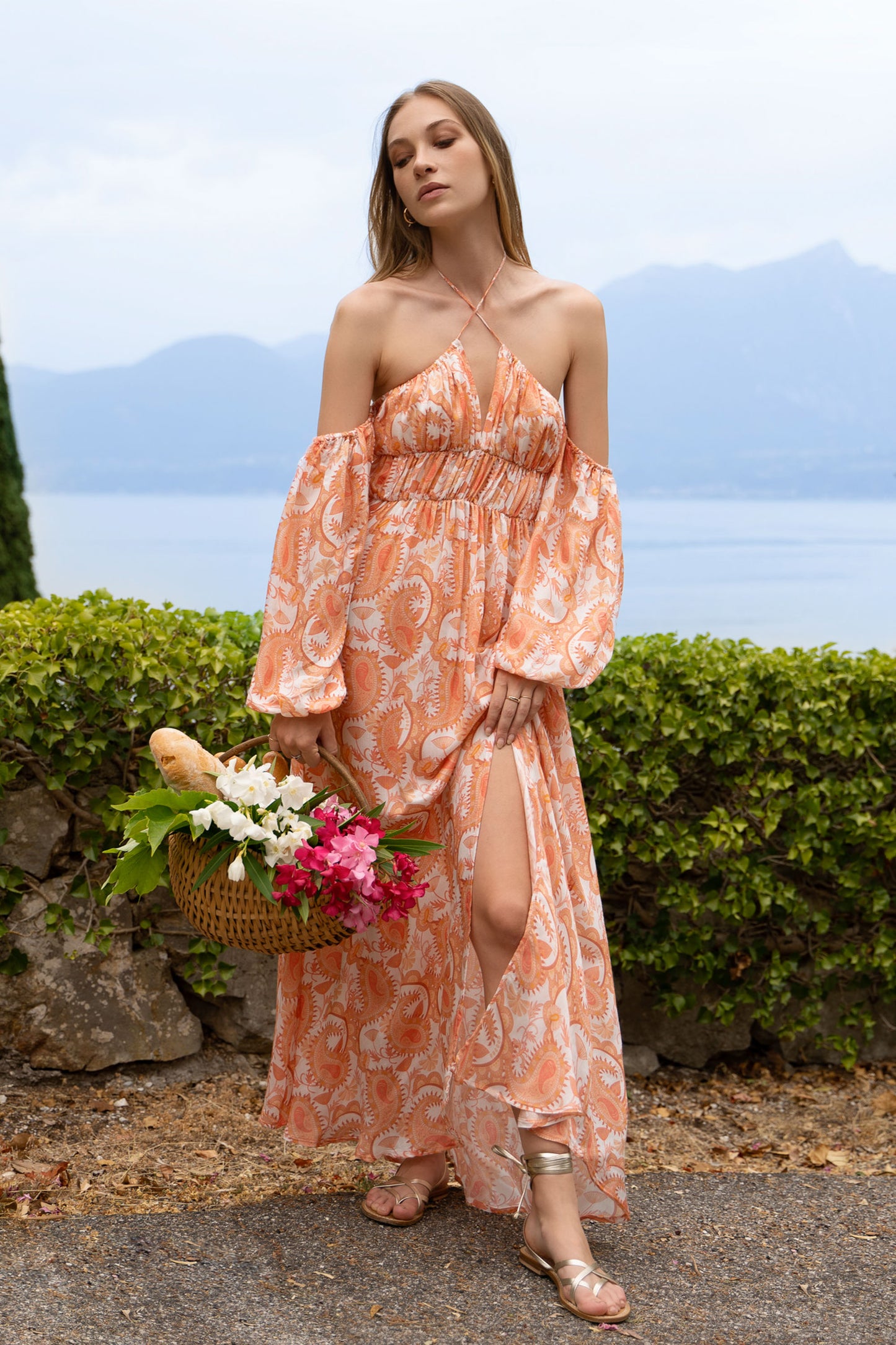 Paisley printed maxi dress with puff sleeves and shirred bodice.