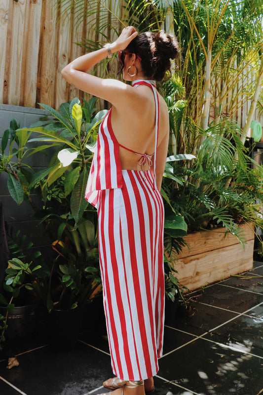 Striped set with pencil skirt, asymmetrical top, red and white stripes and open back.