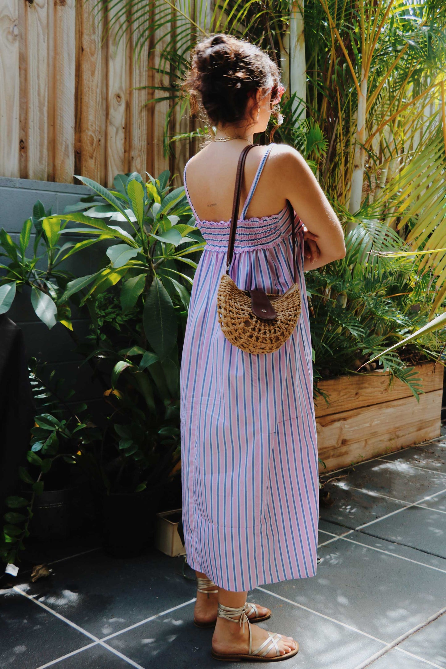 Maxi dress in pink, blue, white stripes.