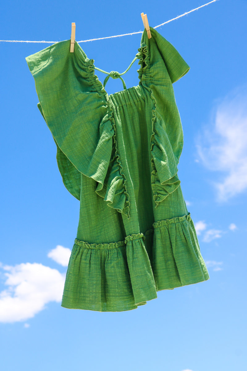 Full figure green dress with frills, for toddlers, doble cotton gauze sustainable fabric.